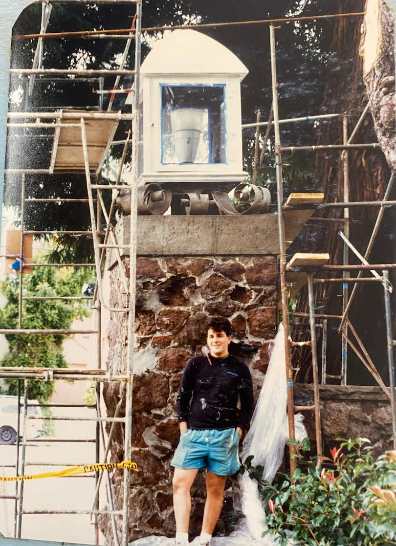 A young Dan Goldstein stands in front of his lantern pillar restoration project in Berkeley, California, in 1989.