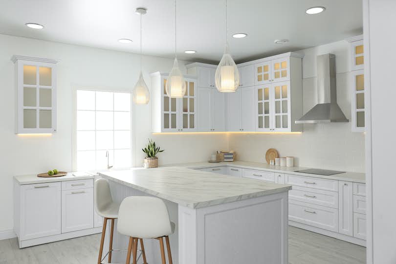 All white kitchen interior with new stylish furniture