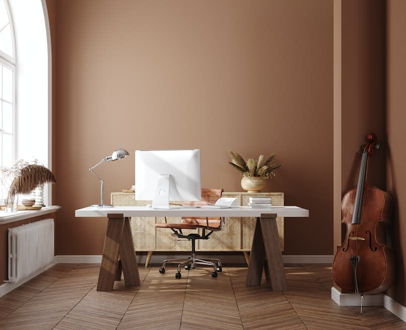 minimalist home office with soothing earth tones walls and natural light