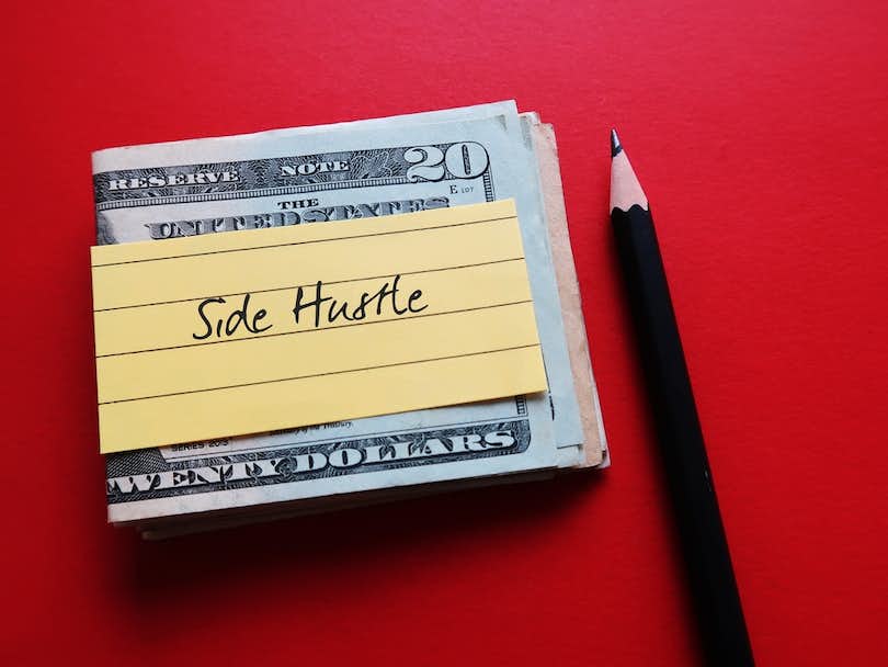 A stack of money labeled Side Hustle