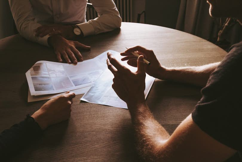 transaction broker meeting at table