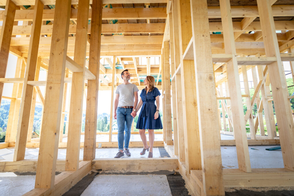 Couple walking through new construction home