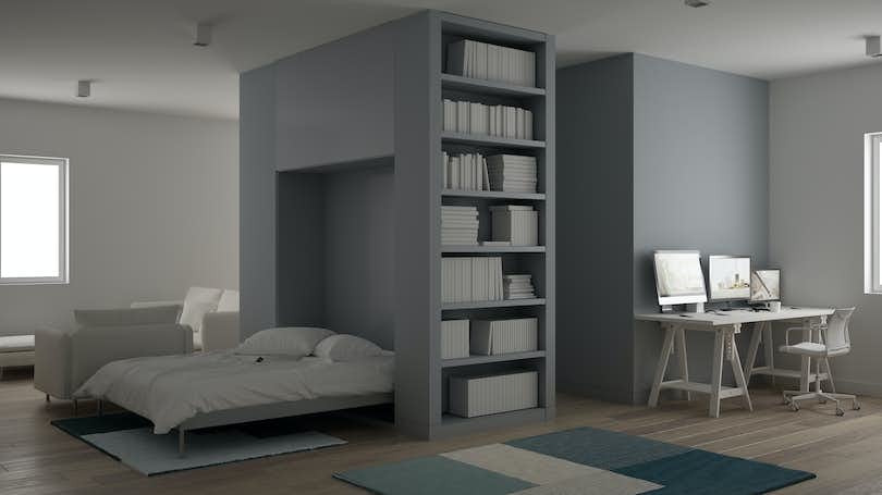 An apartment featuring a murphy bed with built-in storage