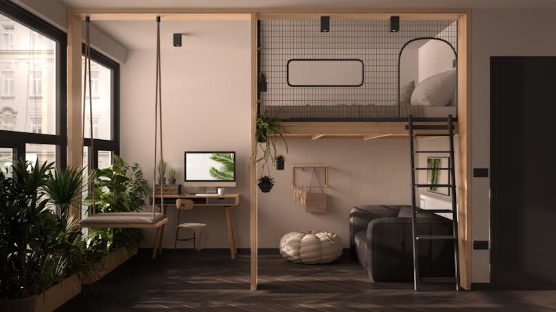 Minimalist studio apartment with loft bunk double bed, mezzanine, swing. Living room with sofa, home workplace, desk, computer. Windows with plants, white and gray interior design.