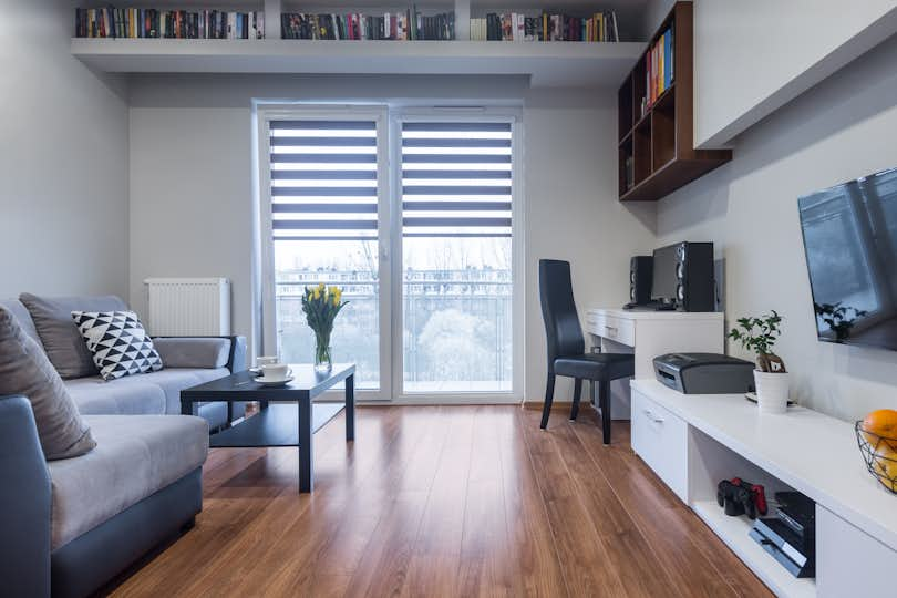 An apartment featuring added storage along the walls