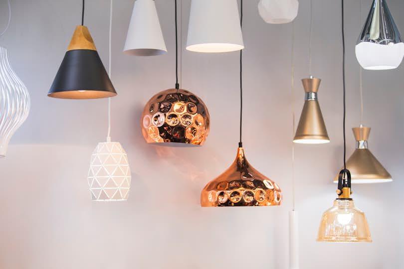 Different modern streamlined mirror copper chandeliers. Bubble metal copper shade pendant.